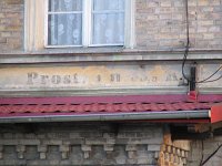 16.08.2006, Stare Juchy, budynek stacji PKP i wyłaniający się spod farby napis pamiętający początki tej trasy: 